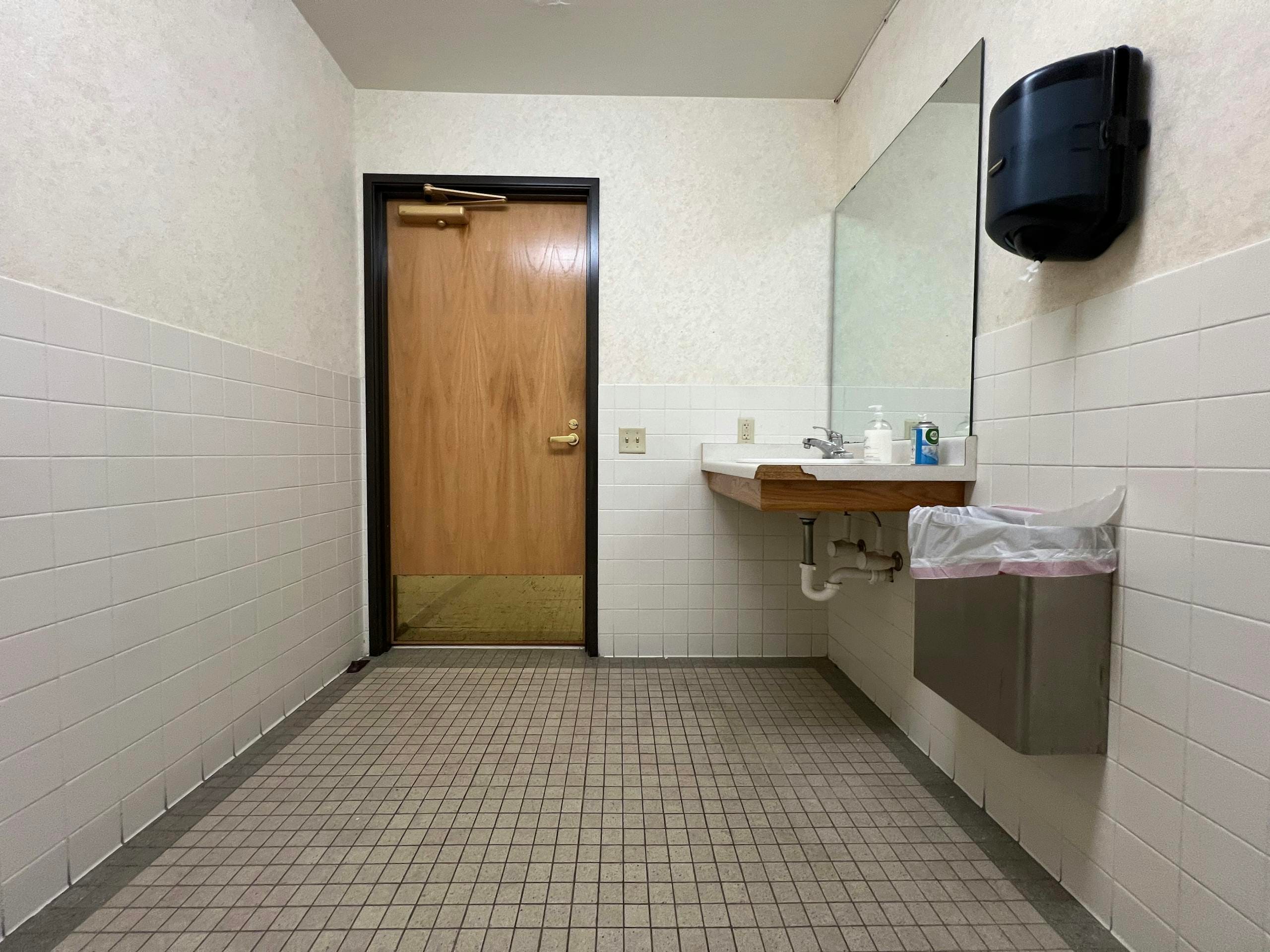 Professional restroom supplies and emergency eye wash station in a modern workplace